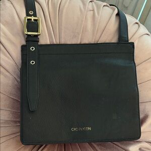 Calvin Klein pebbled leather black cross body bag, adjustable strap.